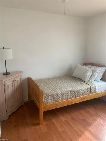 Bedroom with light hardwood / wood-style floors