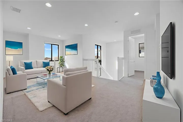 Virtually staged versatile loft area on second floor.