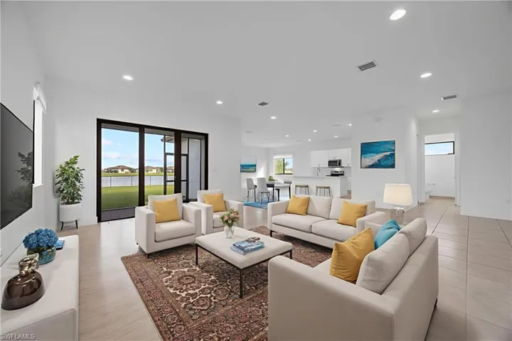 Virtually staged living area featuring tile throughout.