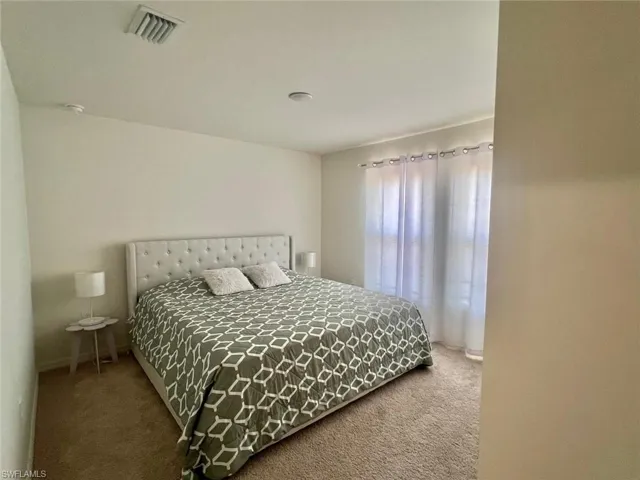 Bedroom with carpet