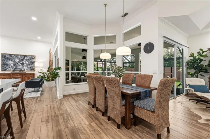 The formal dining area is spacious and beautifully appointed with custom alabaster lighting, creating an elegant ambiance for entertaining.