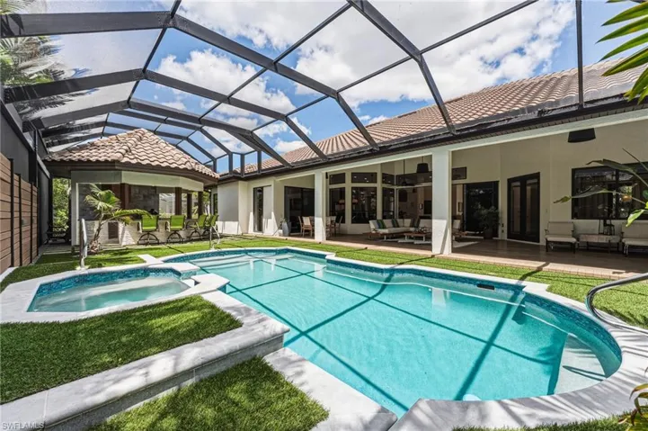 This exceptional home features one of the deepest lanais available, offering true indoor-outdoor living for entertaining in any weather. The inviting cabana provides the perfect setting for BBQs and relaxed gatherings, ideal for effortless entertaining.