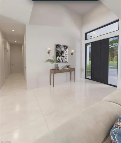 Entryway featuring high ceilings, a dark paneled door with side lights and a transom window, recessed lighting, and light-toned tile flooring