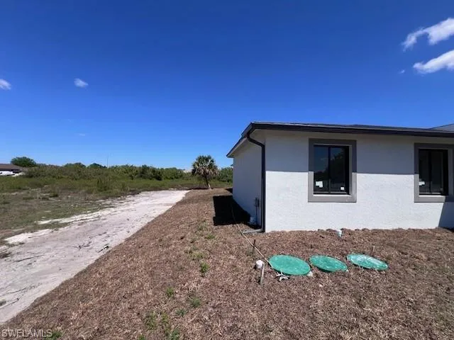View of side of property with stucco siding