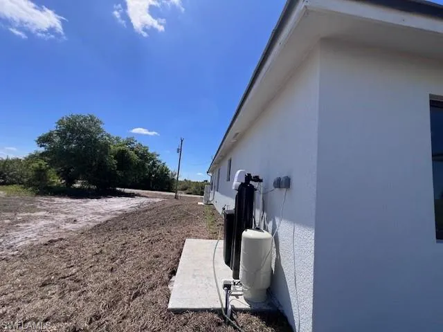 View of side of home with stucco siding