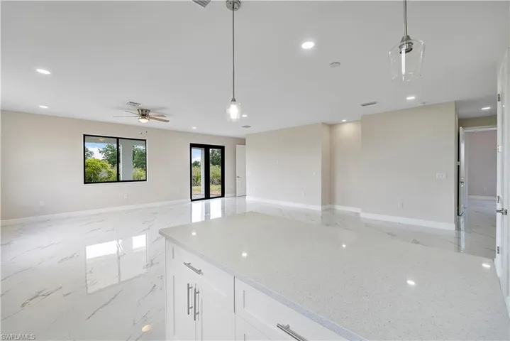 Unfurnished room featuring light marble finish floors, recessed lighting, and ceiling fan