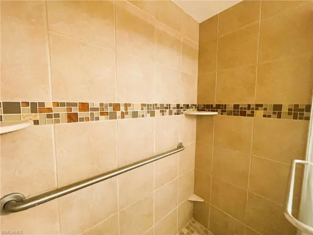 Bathroom with tiled shower