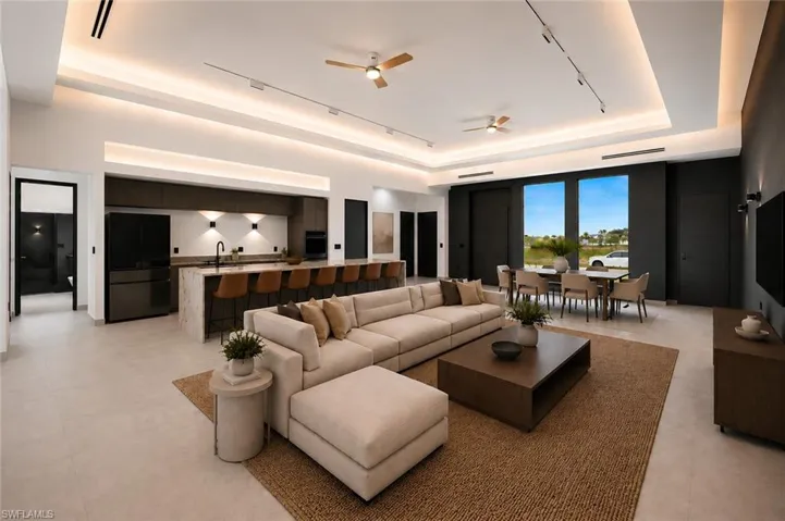 Expansive open-concept living space featuring a modern kitchen, dining area, and lounge