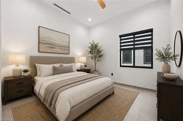 Virtually Staged, Spacious bedroom featuring light-toned tile flooring, recessed lighting, and a ceiling fan