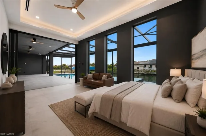 Spacious room with light-toned flooring and dark accent walls