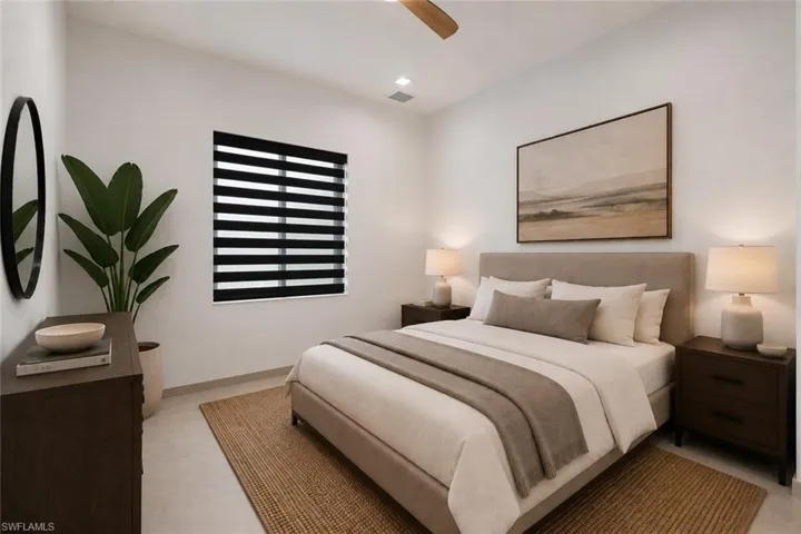 Bedroom featuring white walls, a single window with layered blinds, and recessed lighting