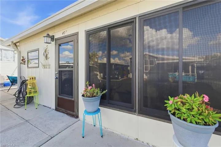 Doorway to property featuring a patio area