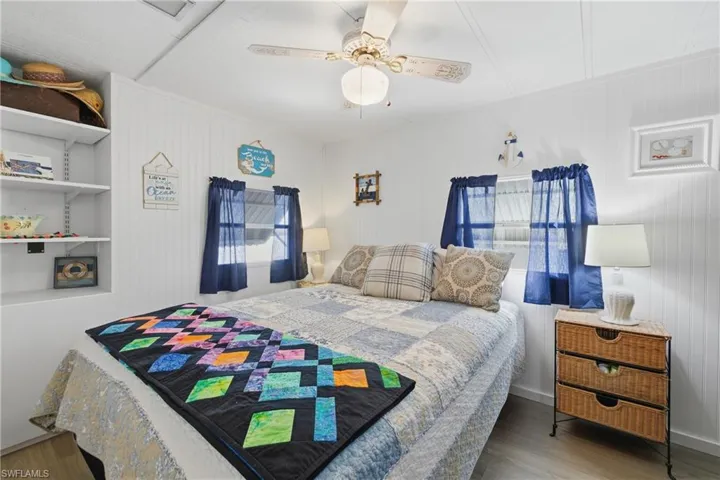 Bedroom featuring wood finished floors and a ceiling fan