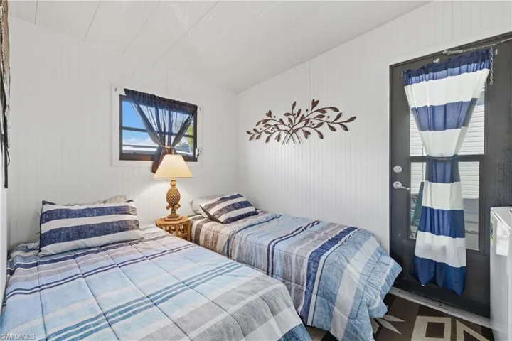 Bedroom featuring washer / dryer