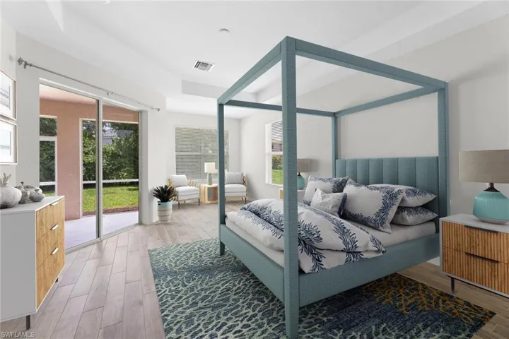 Virtually Staged Primary Suite with plank tile floors and access to exterior