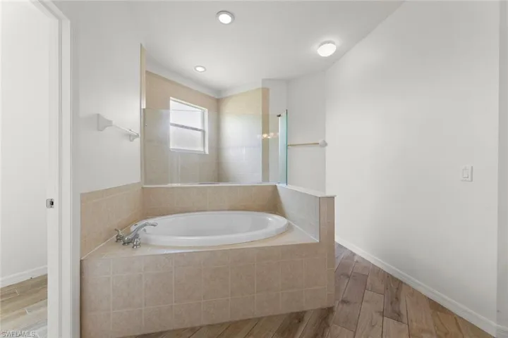 Primary Bathroom with separate tub and shower