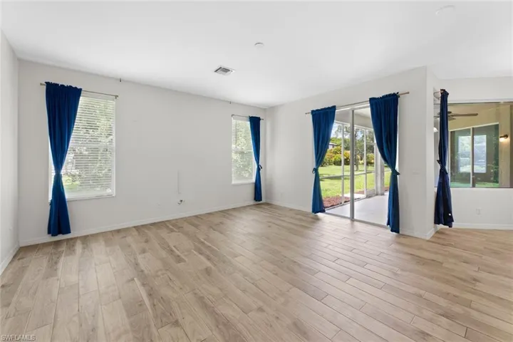 Living room off of the kitchen featuring a sliding glass door out to the covered lanai