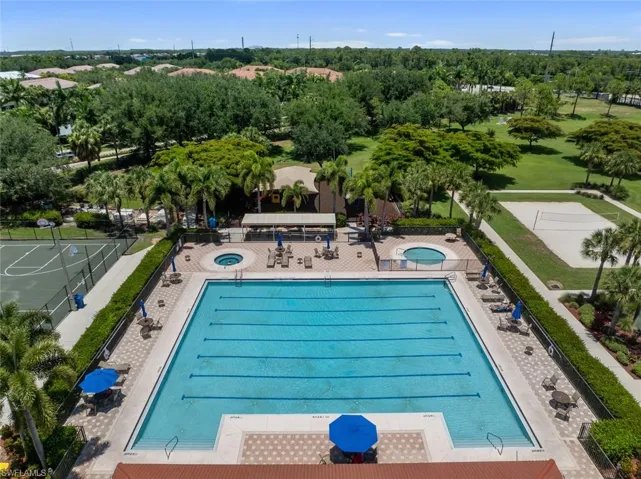 View of pool featuring a community hot tub and a patio
