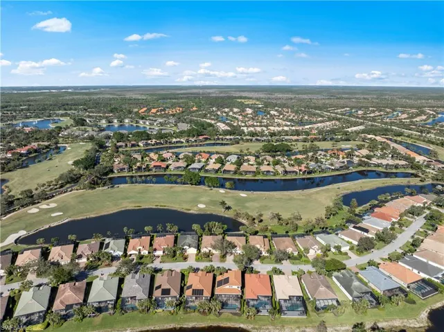 Aerial overview of property's location with a local golf course and nearby suburban area