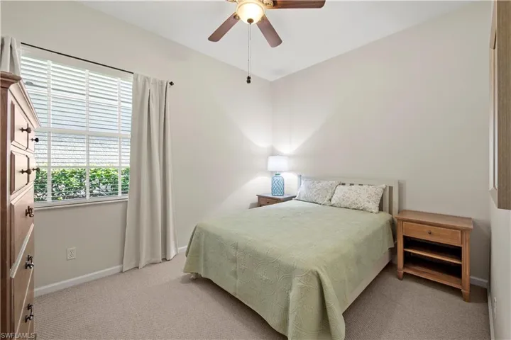 Bedroom featuring carpet flooring and a ceiling fan