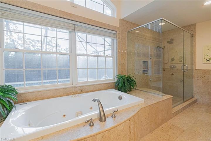 enormous shower across from toilet /storage