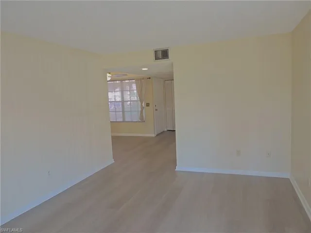 LIVING AREA WITH VIEW OF FRONT ENTRY