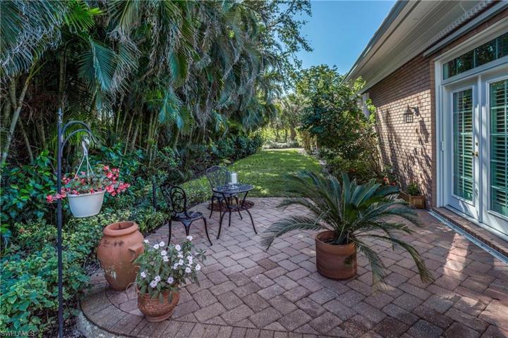 Walk out to the large side yard with built in patio off the kitchen and master bedroom.