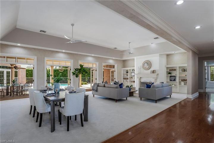 10 foot ceilings and fireplace in the over sized combo dining living room area.