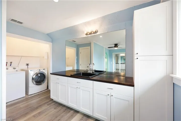 Upstairs laundry room with plumbing to turn into bathroom