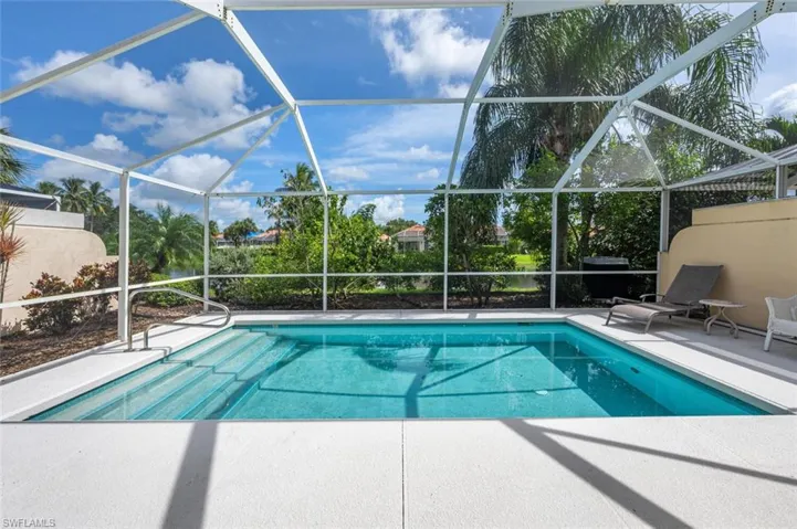 View of pool featuring a lanai and a patio area