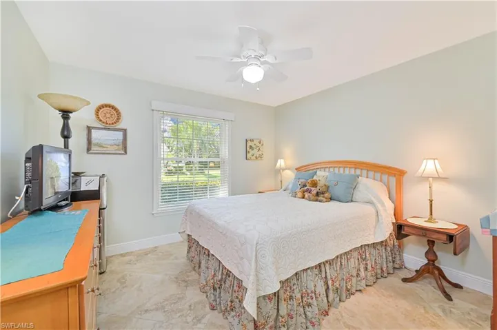 Bedroom with baseboards and a ceiling fan