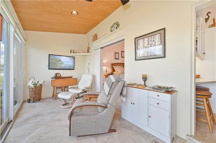 Sitting room with wood ceiling