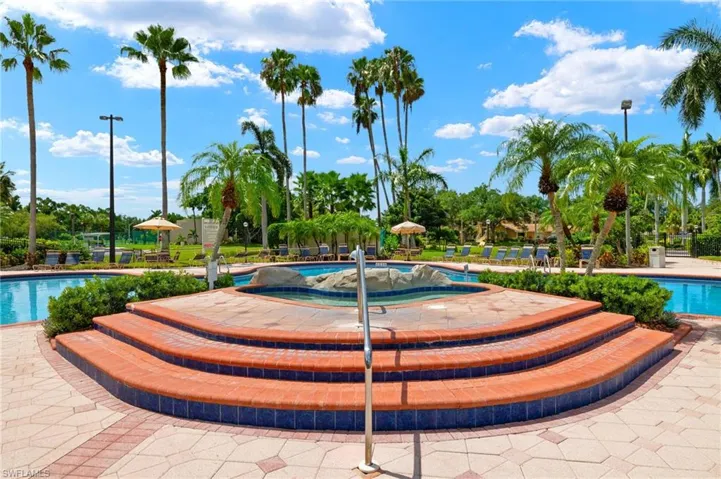 Community pool with a patio area