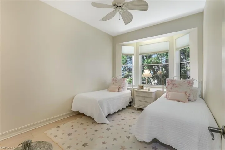 Twin bedroom has a window seat area