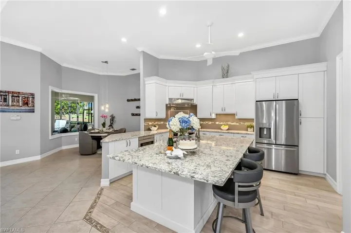 Walls have been removed during the kitchen remodel, which includes quartz counters, new appliances, gas range, and truly abundant storage.