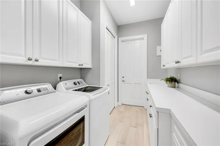 Laundry has such abundant storage...and leads to the 2-car plus golf cart garage.
