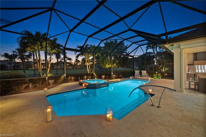 Such serenity...the custom-lit pool screen and extra landscape lighting make evenings here truly beautiful to look out at the view.