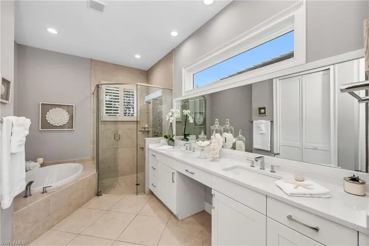 Primary bath has been updated with quartz counters, new fixtures, and impact windows.