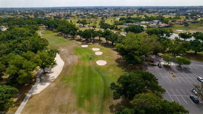 Aerial overview of property's location with a local golf course