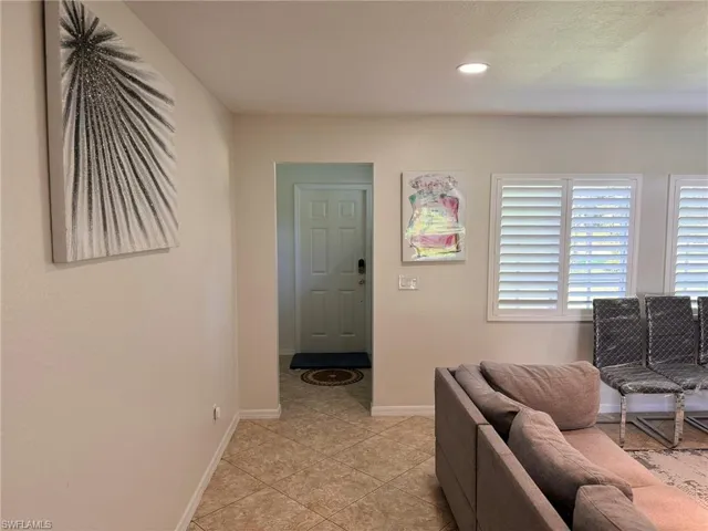 Living room featuring light tile patterned flooring