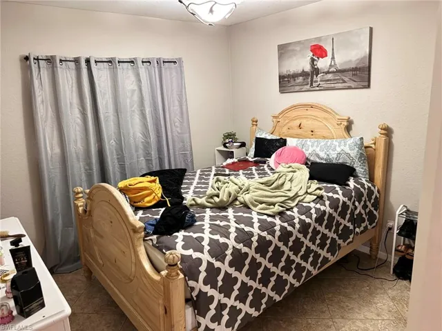 Bedroom featuring tile patterned floors