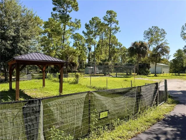 Surrounding community with a gazebo and a yard