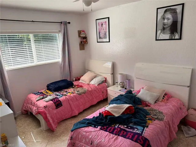 Bedroom featuring ceiling fan and light tile patterned floors