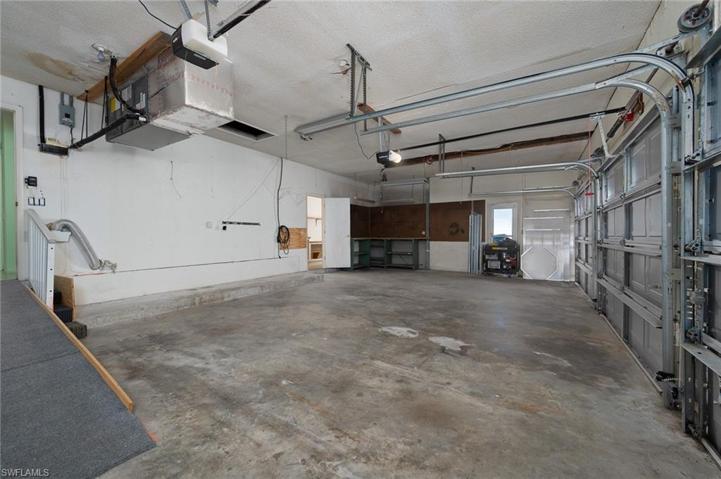 3 Car Garage with seperate 9x12 AC room