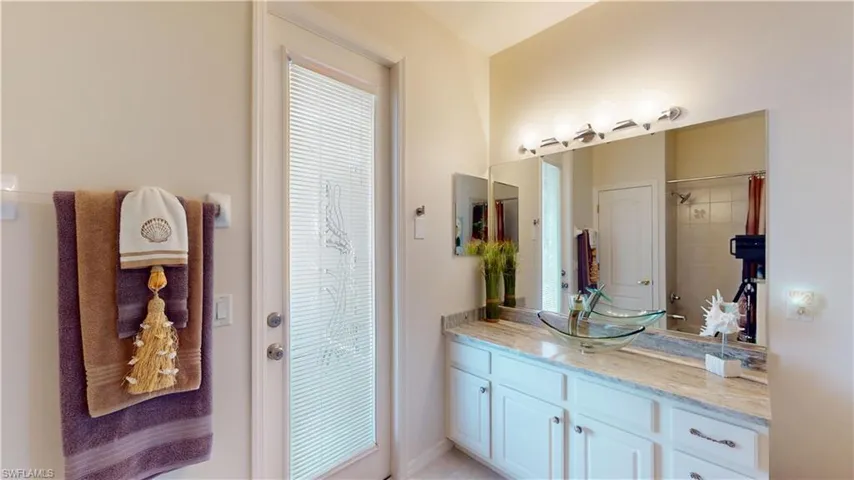 Bathroom with vanity and a shower with curtain