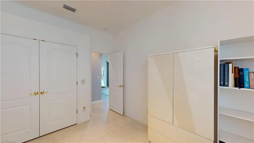 Unfurnished bedroom with multiple closets
