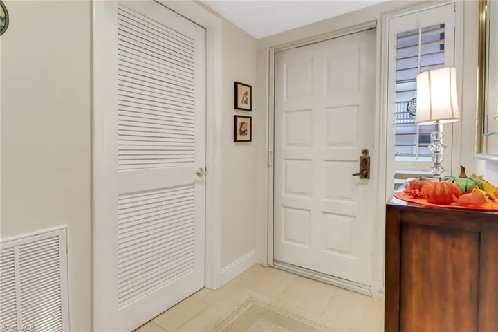 Doorway to outside with light tile patterned floors