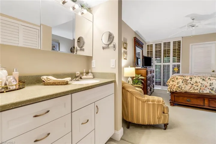 Bathroom featuring vanity and ceiling fan