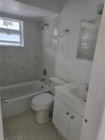 Full bathroom featuring vanity and shower / bath combination