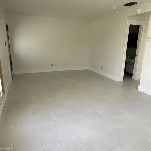 Empty room featuring a textured ceiling